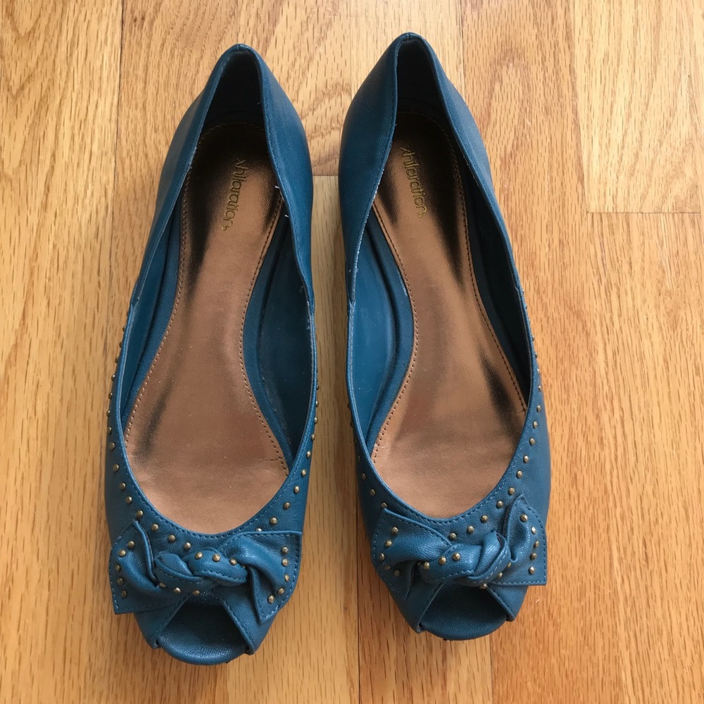 Teal-blue flats with bronze metallic detail